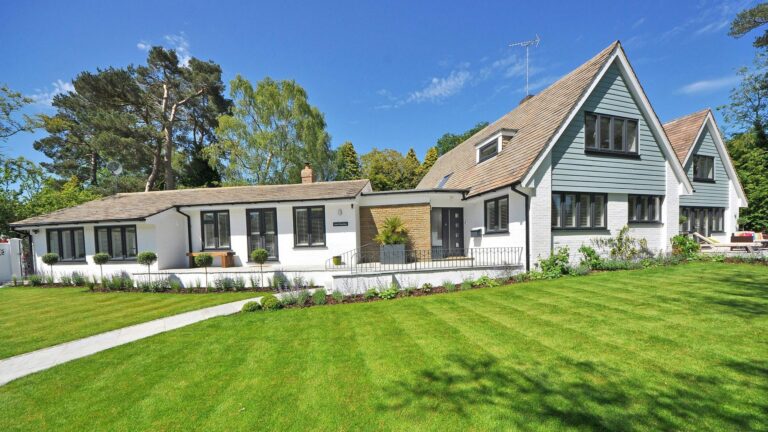 Home for sale in Rincon, Georgia with manicured lawn and modern exterior in Effingham County