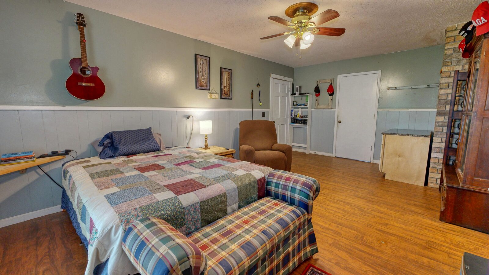 Main-level bedroom with hardwood floors at 193 Grace Lane, Rincon GA