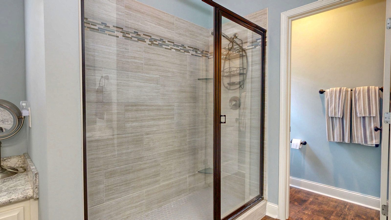 Primary bath tiled shower with dual heads at 505 Trinity Ave, Brooklet