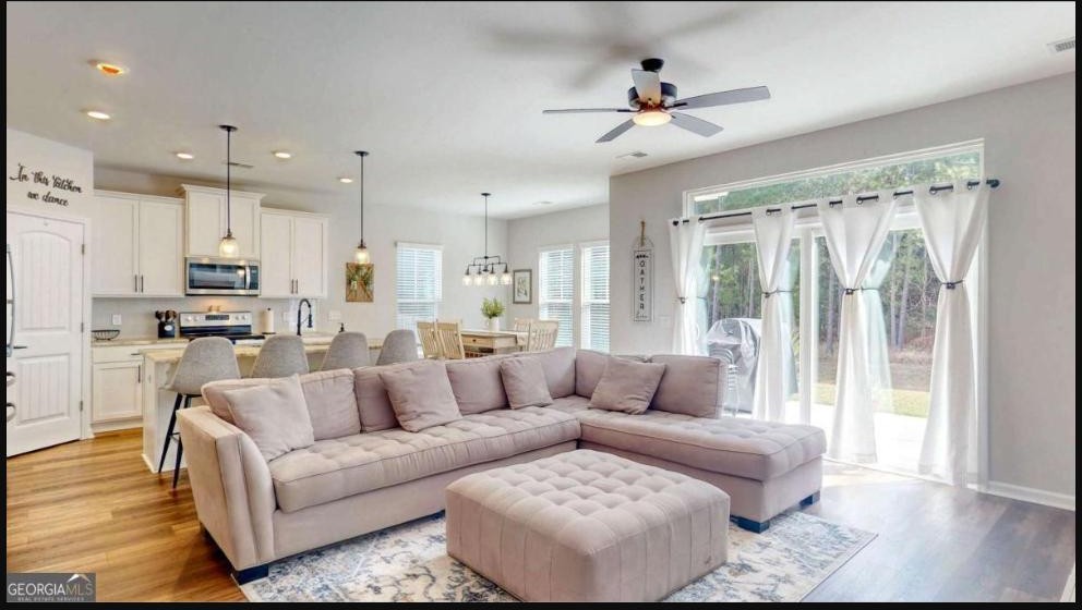 Open-concept living and kitchen area at 124 Brookline Drive in The Highlands