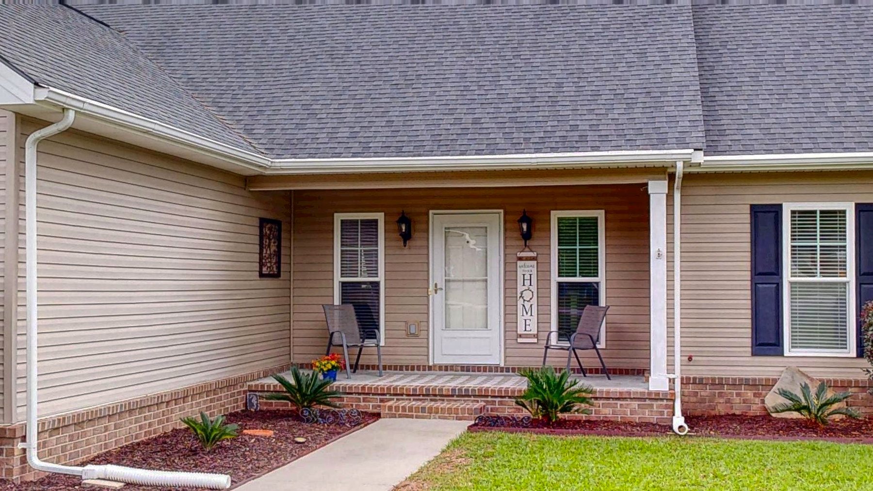 Covered front porch with retractable screen door at 124 Sugarland Blvd in Brooklet, Georgia