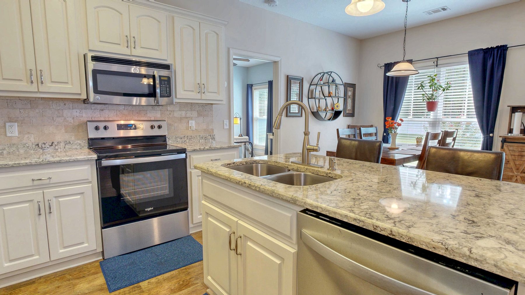 Kitchen with quartz counters and stainless appliances in this Brooklet GA home for sale