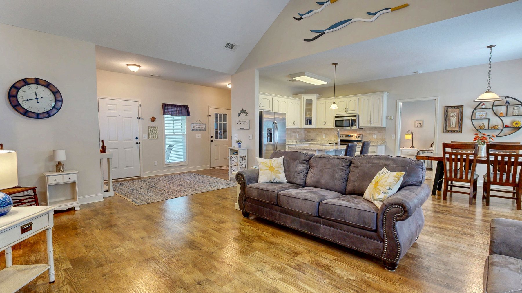 Open living and dining area with LVP flooring at 124 Sugarland Blvd in Brooklet, Georgia