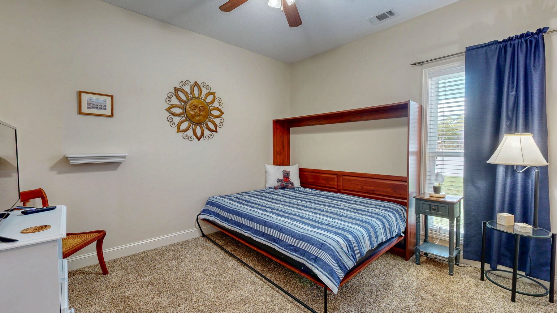 Murphy bed lowered in the spare bedroom at 124 Sugarland Blvd in Brooklet, Georgia