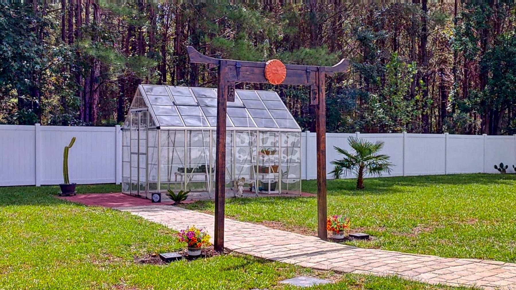 Custom timber garden gate and greenhouse at this Brooklet GA home for sale