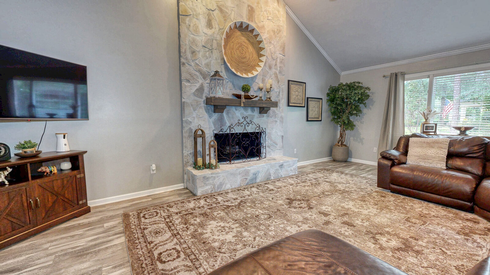 Fourteen-foot vaulted great room with a stone gas fireplace at 129 Palmetto Drive