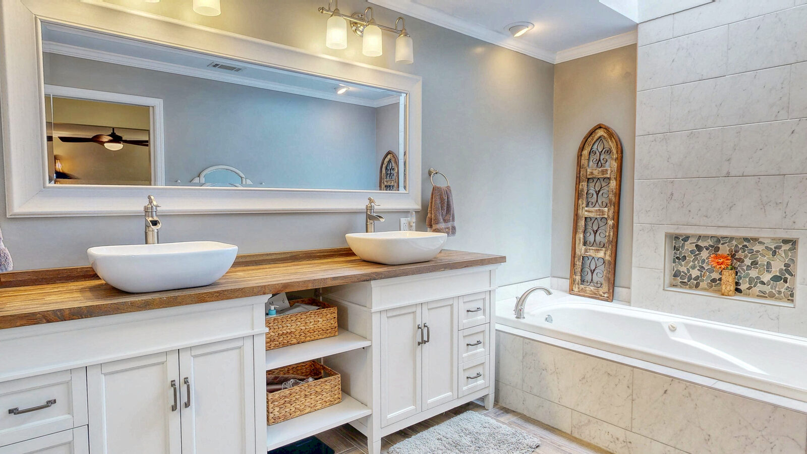 Primary bathroom with double vanity and soaking tub at 129 Palmetto Drive