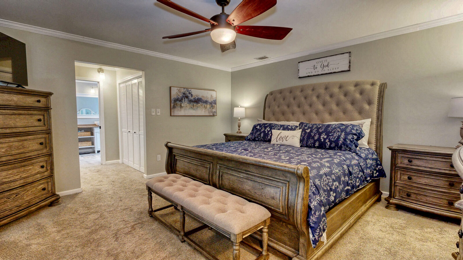 Primary bedroom with French doors at 129 Palmetto Drive, Rincon GA
