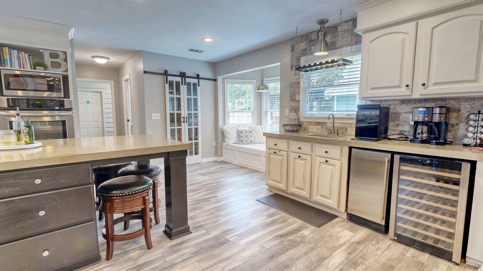 Wet bar and beverage center with wine refrigerator at 129 Palmetto Drive, Rincon GA