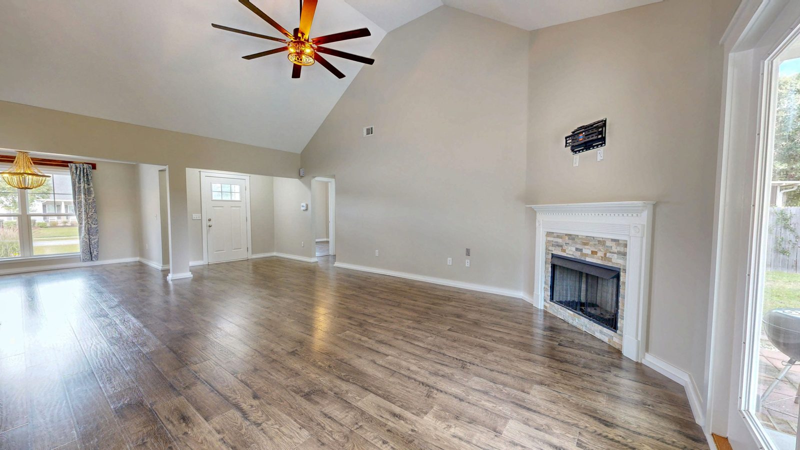 Great room fireplace and wood flooring