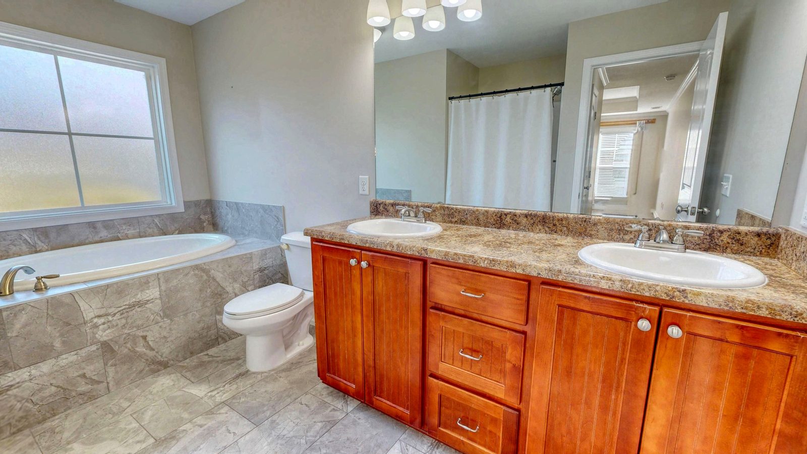 Primary bath with double vanity and garden tub